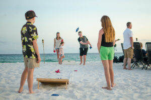 playing fun games at the beach friends