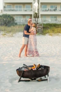 couple kissing by the bonfire